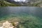 Beautiful teal water and rocks in Lake Sabrina near Bishop CA