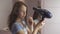 Beautiful teen girl dries hair a hairdryer in bathroom slow motion stock footage video