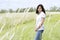 Beautiful teen girl in grassy field