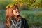 Beautiful teenage girl enjoying sunny autumn day