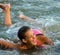 Beautiful teenage girl having fun in the sea