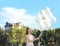 Beautiful teenage girl holding glitter balloons