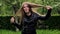 Beautiful teenage girl long blond hair moving dancing crazy emotions in park