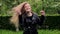 Beautiful teenage girl long blond hair moving dancing crazy emotions in park