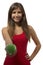 Beautiful teenage girl portrait offering green one apple