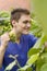 Beautiful teenage picking white grapes