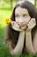 Beautiful teenager with dandelion bouquet