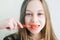 Beautiful teenager girl brushes her teeth