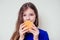 Beautiful teenager girl is eating baked vegetarian burger with vegetables. Child vegan idea healthy eating concept.clear