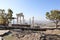 Beautiful temple of Trajan autumn view with white marble columns with blue sky and valley background, ancient city Pergamon, Turke