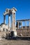 Beautiful temple of Trajan with white marble columns on blue sky background, ancient city Pergamon, Turkey