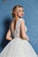 Beautiful tender young woman sexy blond bride in a luxury white wedding dress lace chiffon Summer happiness awaits the groom