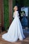 Beautiful tender young woman sexy blonde hair bride in a luxury white wedding dress lace chiffon Summer happiness awaits the groom