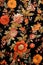 Beautiful textile featuring an extensive black and orange floral pattern adorned with golden accents