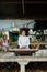 A beautiful Thai girl playing Khim, the traditional Thai music Instrument near the grandmother