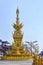 Beautiful Thai style gold clock tower in Chiang Rai city on the blue sky background