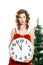 Beautiful thinking christmas girl holding clock