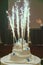 Beautiful three-layered wedding cake with fireworks