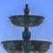 Beautiful tiered fountain with blue sky late day