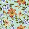 Beautiful tiger lilies and small blue flowers on twigs against light blue background. Seamless floral pattern. Watercolor painting