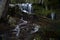 Beautiful time exposure of falling water over rough ground