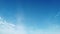 Beautiful time lapse of white cirrocumulus clouds in a light blue summer blue sky