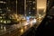 Beautiful timelapse shot of a road with cars and high buildings with night lights in Atlanta