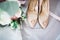 Beautiful toned picture with wedding rings and wedding shoes