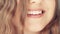 Beautiful toothy smile of young woman with perfect healthy white teeth, health and beauty
