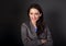 Beautiful toothy smiling business woman in grey suit looking hap