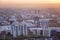 Beautiful top view of the big industrial city of Almaty in the pink light of sunset