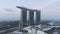 Beautiful top view of the famous Singapore Marina Bay Sands hotel. Shot. Three hight hotel towers and a swimming pool at