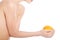 Beautiful topless woman holding an orange.