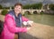 Beautiful tourist enjoyng the view of  bridge over tiber river in Rome, Italy