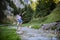 Beautiful tourist enjoys nature next to a mountain river