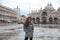 Beautiful tourist girl with long wavy hair in San Marco square i