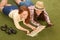 Beautiful tourist ladies lying on green grass