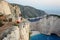 Beautiful tourist at Navagio beach, Zakynthos Island, Greece