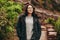 Beautiful tourist standing on stone stairs on mountain