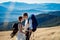 Beautiful tourist wedding couple hugs on the top of mountain. Honeymoon in Alps