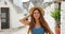 Beautiful tourist woman enjoying view of Alberobello old town in Apulia, Italy