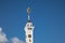 A beautiful tower with a clock and a star on the spire.