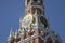 A beautiful tower of the Moscow Kremlin with a clock.