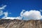 Beautiful towering mountains under the blue sky and white clouds