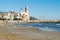 The beautiful town of Sitges with seagulls, Landscape of the coastline in Sitges, ParrÃ²quia de Sant Bartomeu i Santa