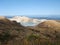 Beautiful toxic and acidic volcanic caldera lake with emerald green water in Yugama, Kusatsu, Gunma prefecture, Japan