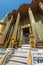 Beautiful traditional gold statues at ornate entrance to Phra Mondop at Temple of Emerald Buddha in Grand Palace complex, Bangkok