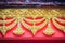 Beautiful traditional golden Thai style stucco patterned for decorative on wall background at Buddhist temple in Thailand.