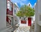 Beautiful traditional narrow cobbled streets, small squares of Greek island towns. Whitewashed houses. Small chapel and