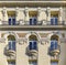 Beautiful traditional residential buildings with metal balconies in the streets of the city center in Madrid, Spain